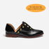 Single black leather d'Orsay oxford shoe with gold studs and a brown sole, shown in profile on a white background.